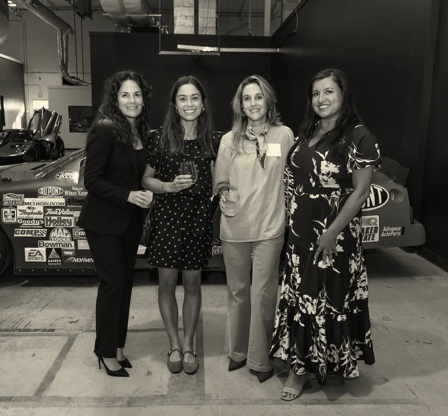 Four guests standing together at an Off The Grid evening